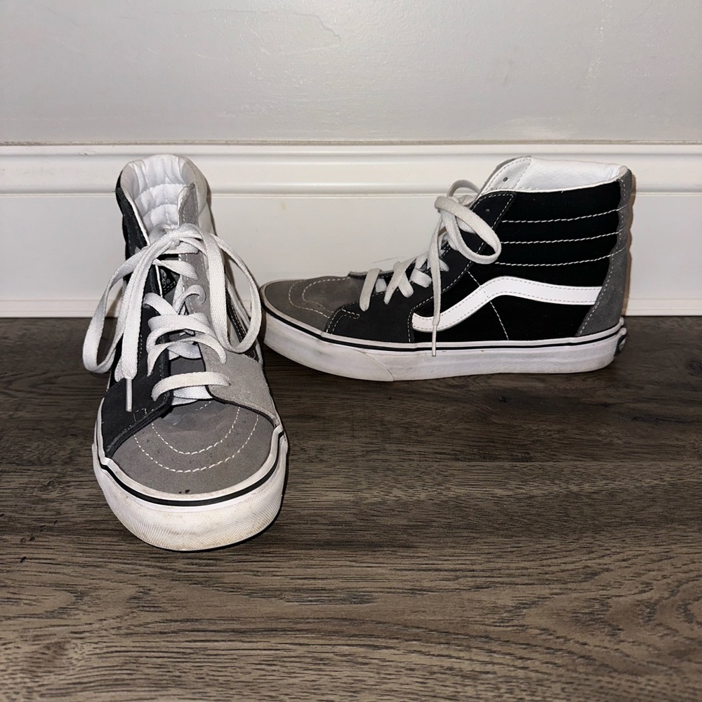 women's black, gray, and white color block high top vans.